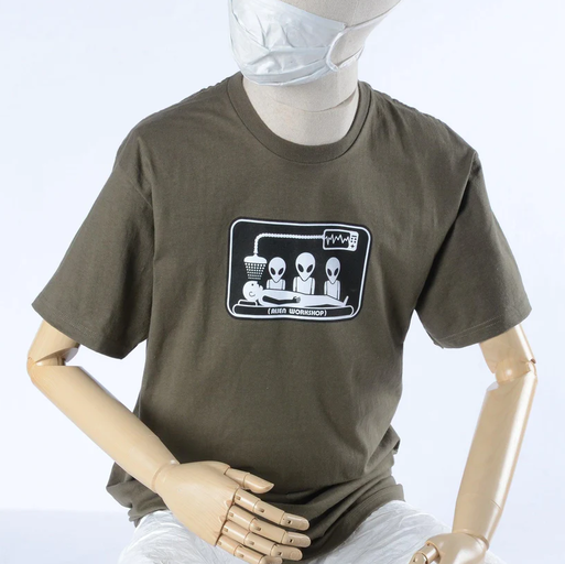 A mannequin wearing olive green abduction t-shirt