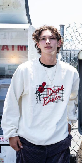 A man wearing white sweatshirt