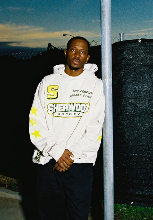 A man wearing white hoodie