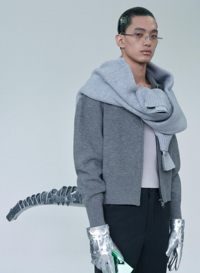 A man wearing ash grey sweatshirt