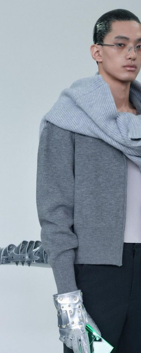 A man wearing ash grey sweatshirt