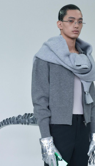 A man wearing ash grey sweatshirt