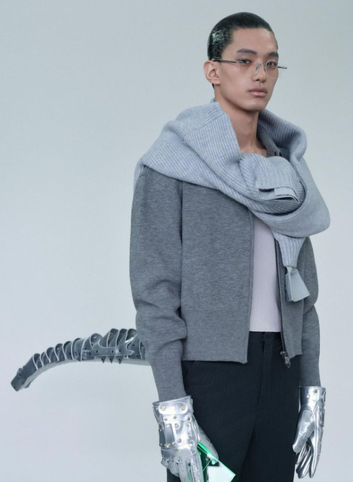 A man wearing ash grey sweatshirt