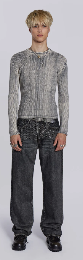 A man wearing a Jaded London black shirt with oversize dark grey jeans