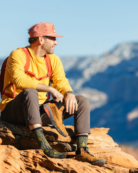 A man wearing a pair of yarn goblin micro crew lightweight Darn Tough hiking sock