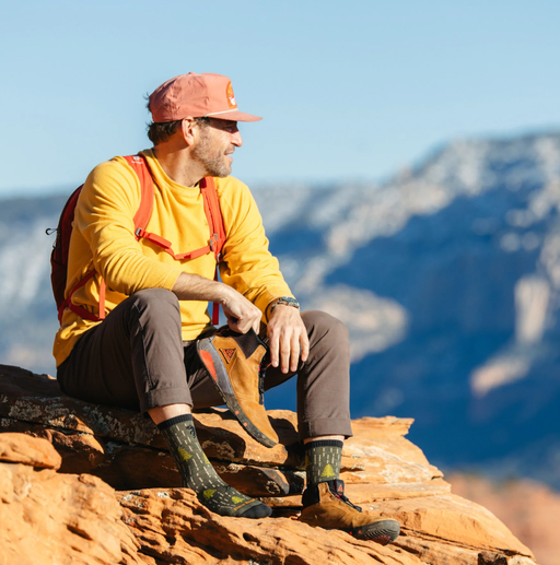 A man wearing a pair of yarn goblin micro crew lightweight Darn Tough hiking sock