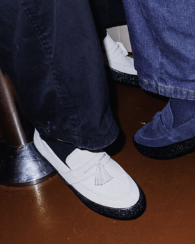 A close up of white shoes from Fast Times Melbourne