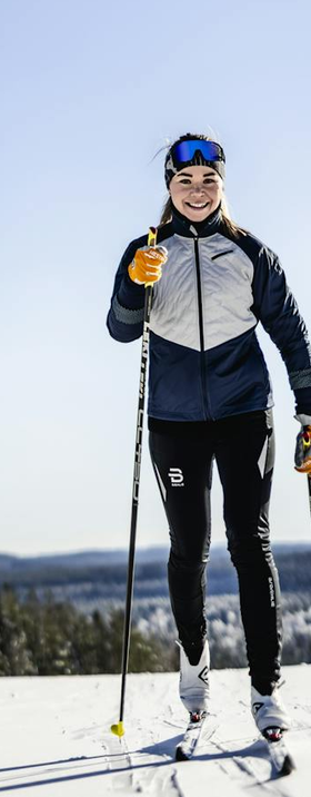 A woman wearing ergo grip windstopper race gloves by Hestra