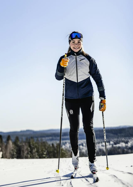 A woman wearing ergo grip windstopper race gloves by Hestra