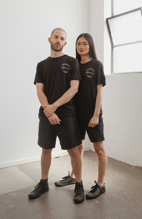 A couple wearing black classic unisex organic cotton t-shirt from Kodama