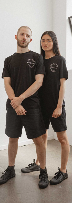 A couple wearing black classic unisex organic cotton t-shirt from Kodama