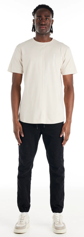 A man wearing a Nana Judy saint t-shirt in white