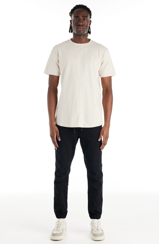 A man wearing a Nana Judy saint t-shirt in white