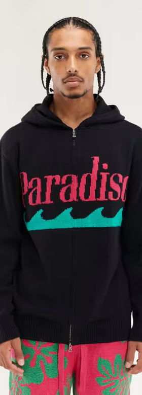 A man wearing black & flamingo paradise zip hoodie by The Elder Statesman