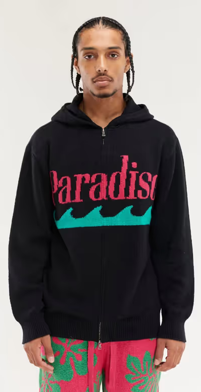 A man wearing black & flamingo paradise zip hoodie by The Elder Statesman