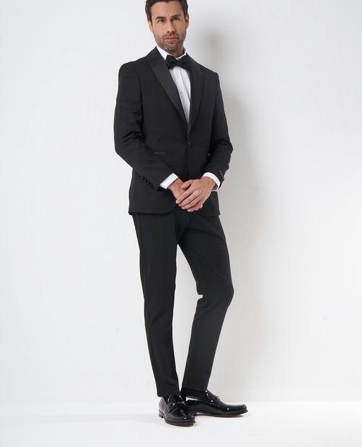 A man wearing Sepol black dress shoes