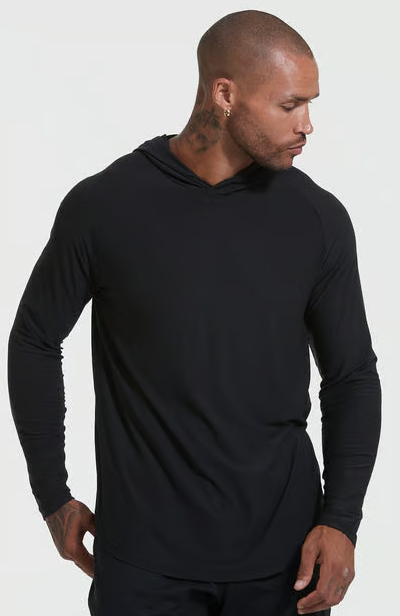 A man wearing black active True Classic hoodie