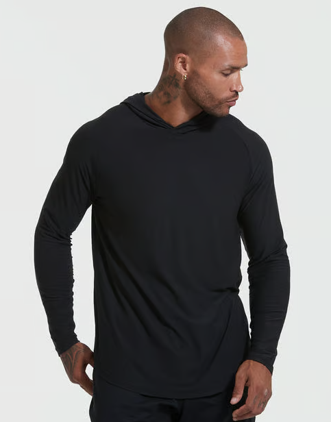A man wearing black active True Classic hoodie