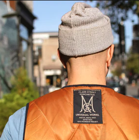 An image of a Clark Street Mercantile vest collab in orange