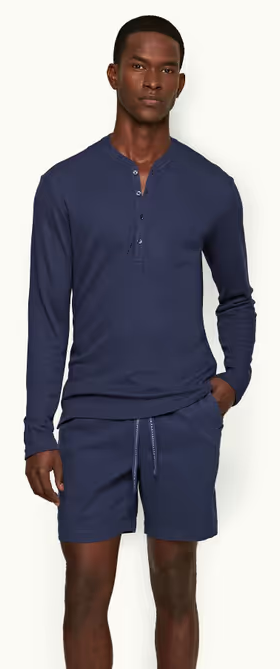A man wearing lagoon blue classic fit long-sleeve cashmere t-shirt by Orlebar Brown
