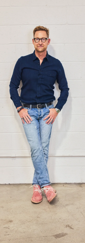 A man wearing pink suede chucka boot lace-up by ESQUIVEL