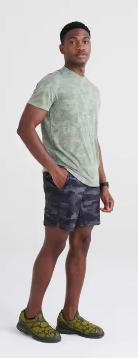 A man wearing short sleeve crew / tar green camo by Saxx