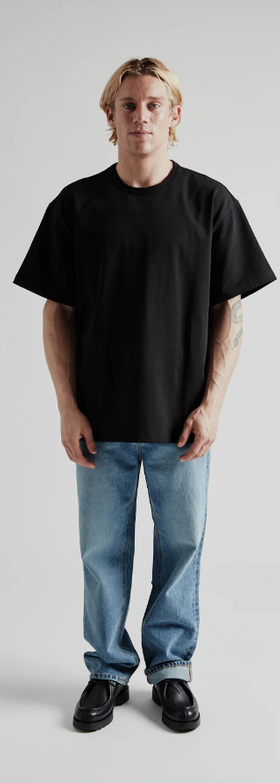 A man wearing og double rib oversized tee from Wallace Street Mercantile