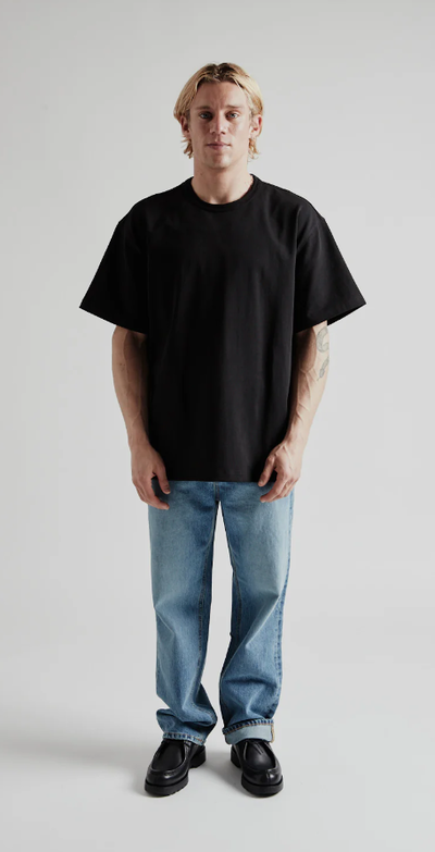 A man wearing og double rib oversized tee from Wallace Street Mercantile
