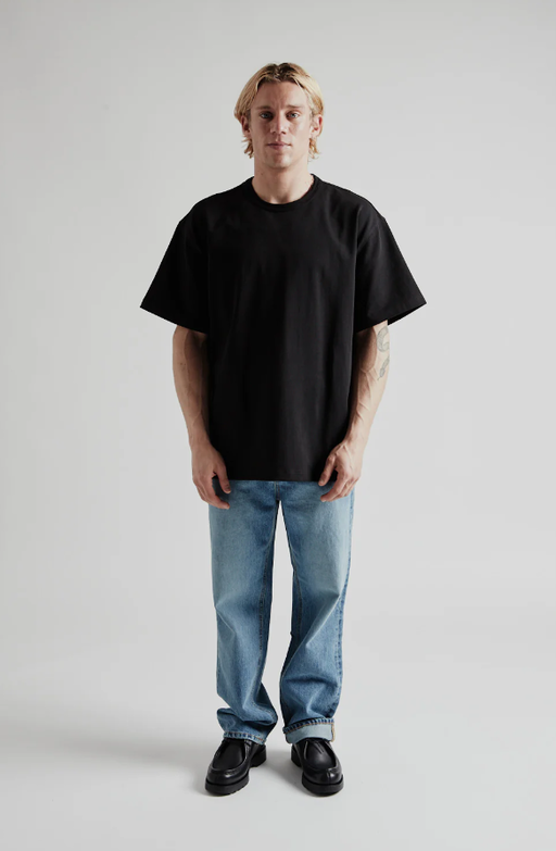 A man wearing og double rib oversized tee from Wallace Street Mercantile