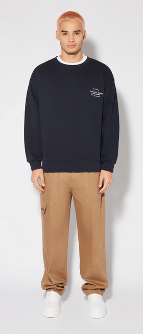 A man wearing blue sweatshirt by PHILIPPE MODEL