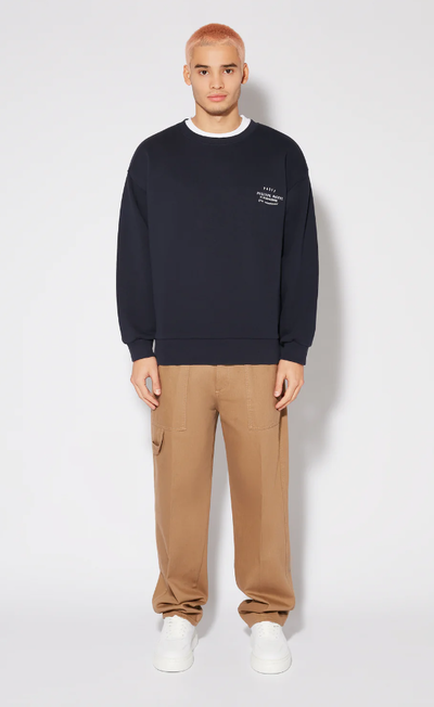 A man wearing blue sweatshirt by PHILIPPE MODEL