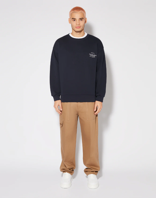 A man wearing blue sweatshirt by PHILIPPE MODEL