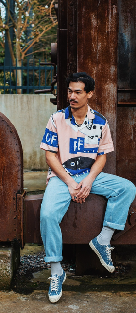 A man wearing a pair of blue novesta shoes