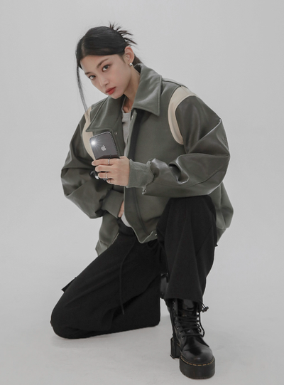 A woman wearing a Norda varsity leather sleeve