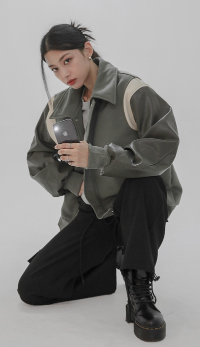 A woman wearing a Norda varsity leather sleeve