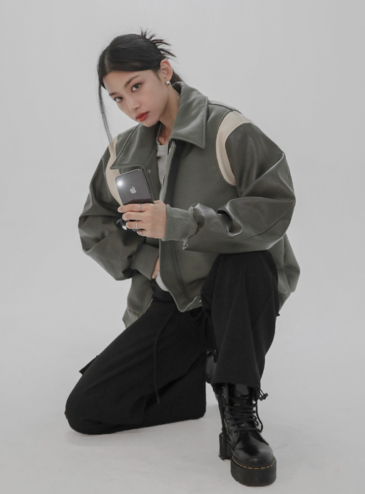 A woman wearing a Norda varsity leather sleeve