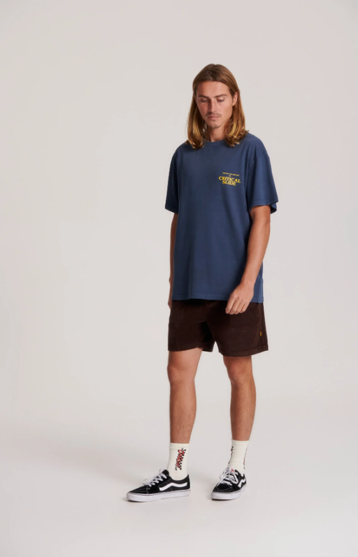 A man wearing director tee in Navy by The Critical Slide Society