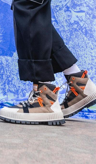 A man wearing a Palladium pallashock outcity boot
