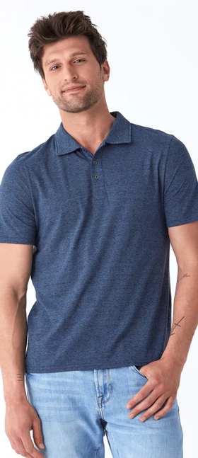 A man wearing a Threads 4 Thought black fleck triblend jersey polo