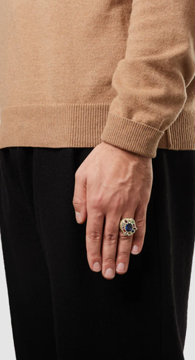 A man wearing a BLEUE BURNHAM cottage garden cocktail ring - gold