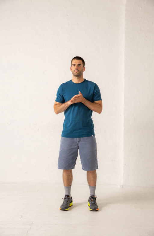 A man wearing a Druthers gots® certified organic cotton t-shirt - dusty indigo