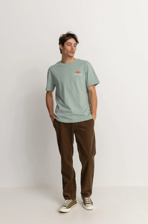 A man wearing a Rythm awake ss t shirt- seafoam