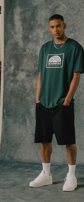A man wearing a South Pole green t-shirt