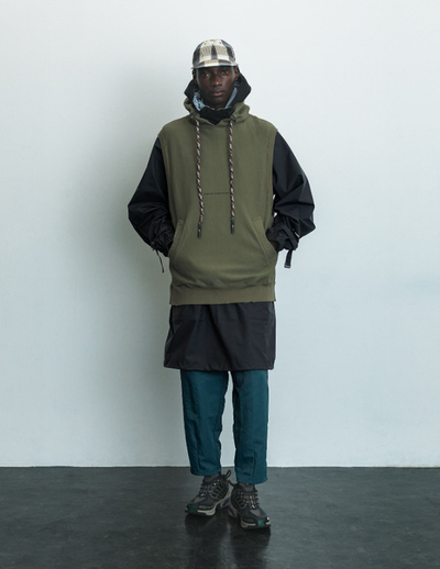 A man wearing a F/CE pertex waterproof coat