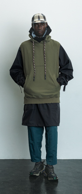 A man wearing a F/CE pertex waterproof coat