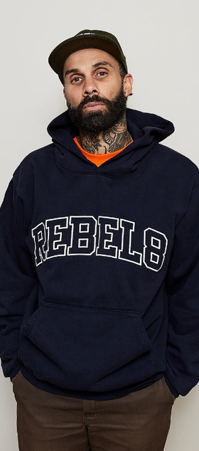 A man wearing a Rebel8 navy blue hoodie