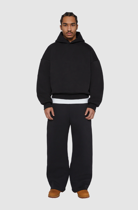 A man wearing a Seventh black night v2 hoodie