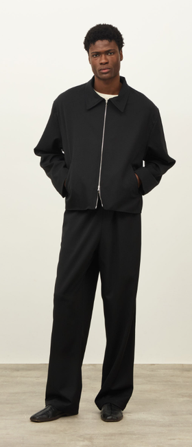 A man wearing a Daniel Simmons colorado jacket - black