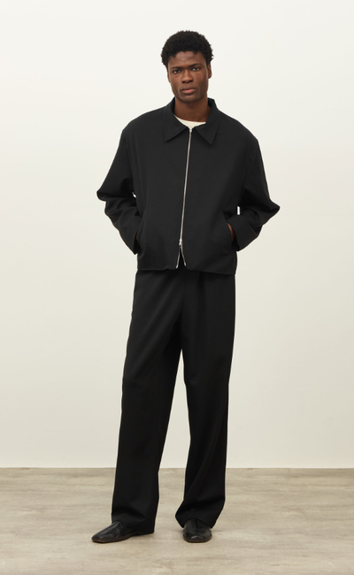 A man wearing a Daniel Simmons colorado jacket - black