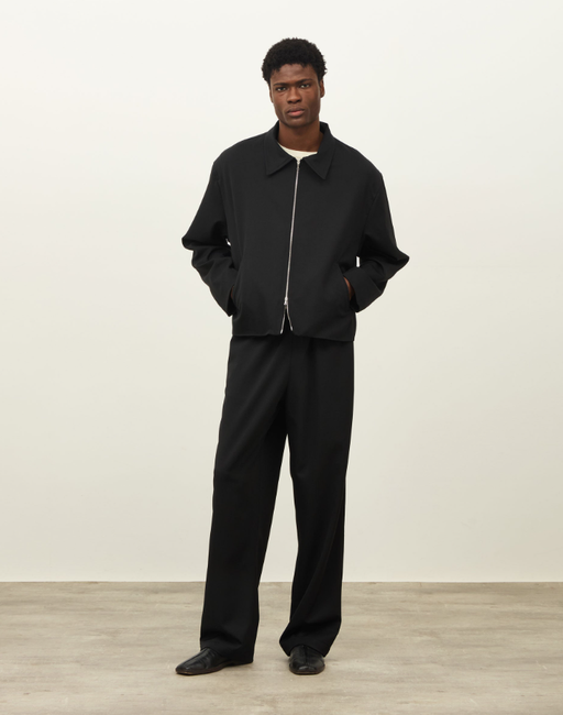 A man wearing a Daniel Simmons colorado jacket - black